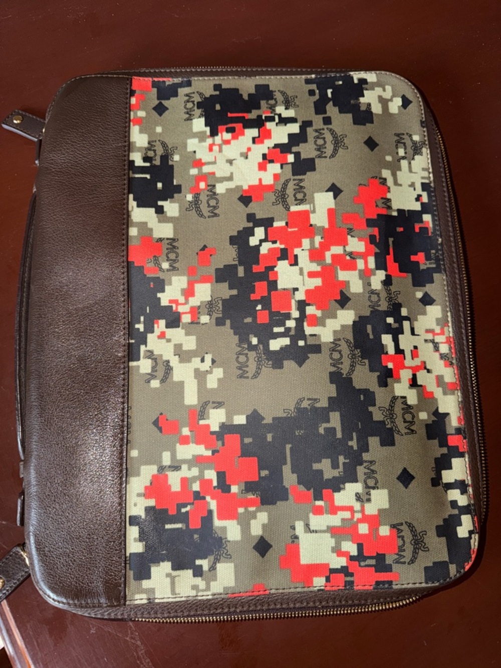 MCM laptop portfolio with brown leather trim and digital camo fabric